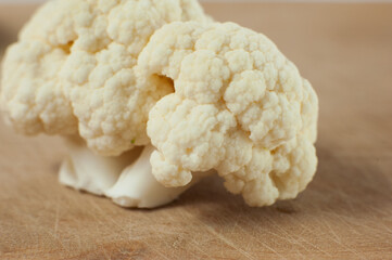Cauliflower on a wooden Board. Macro photo. Selective focus.
