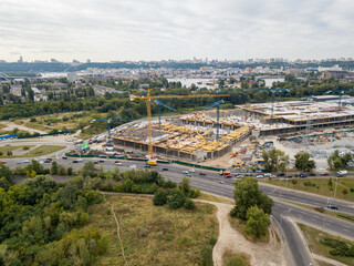 Fototapeta premium Aerial drone view. Construction of a large shopping center