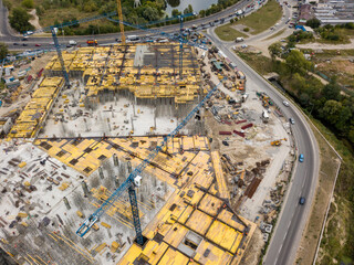 Fototapeta premium Aerial drone view. Construction of a large shopping center