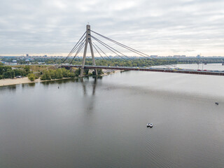 North bridge over the Dnieper river in Kiev. Aerial drone view.