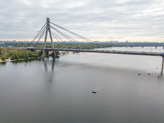 North bridge over the Dnieper river in Kiev. Aerial drone view.
