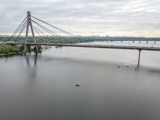 North bridge over the Dnieper river in Kiev. Aerial drone view.