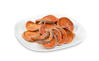 Dry bael fruit or Aegle marmelos in dish isolated on white background ,include clipping path