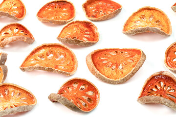 Dry bael fruit or Aegle marmelos isolated on white background