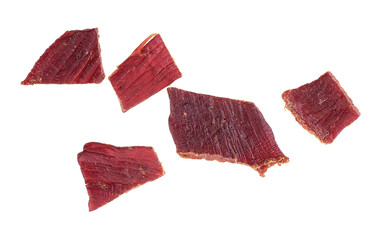 Spices beef jerky pieces isolated on a white background, top view. Dried meat.
