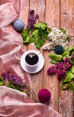 Coffee Cup And Colorful Lilac Flowers On Garden wooden Table