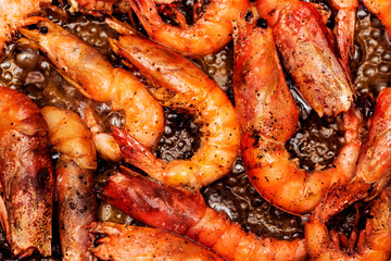 Delicious roasted grilled shrimps background 