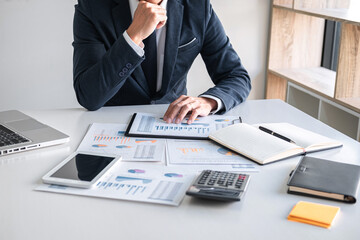 Business Financing Accounting Banking Concept, businessman doing finances and calculate about cost...