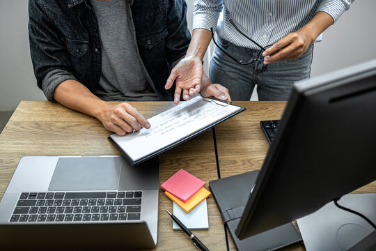 Programmer Team of  Developing programming and website working in a software develop company office, writing codes and typing data code, Programming with HTML, PHP and javascript