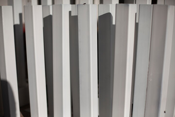 White painted metal profile. Steel product.