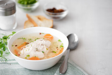 chicken soup with noodles and herbs