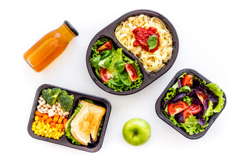 Delivery containers with takeout food on table. View from above