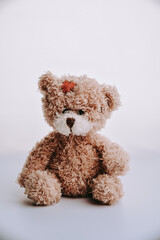 sad teddy bear isolated on white background