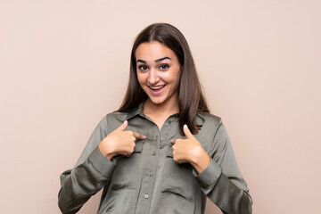 Young girl over isolated background with surprise facial expression