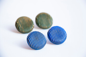 Minimalist blue and green stud earrings of polymer clay. Fashion handmade design.