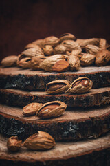 Nuts on a wooden background. Harvesting almonds. Vintage toning.