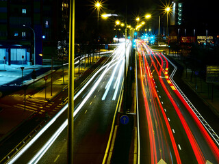 Fototapeta na wymiar The cars lights over the road in the city.