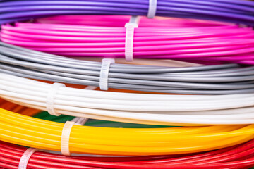 Closeup view of rolled wires for filament plastic for 3D printing pen