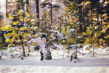 2 years old boy play snow snowballs