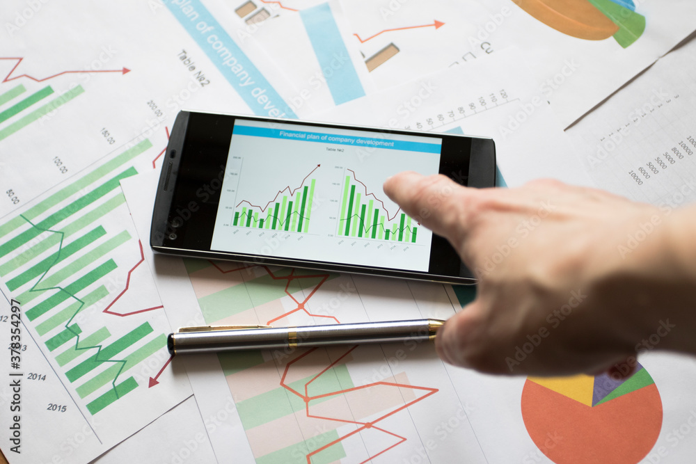 Poster analysis and research of financial data in business on the chart on smartphone.