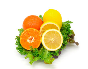 Orange and lemon on salad leaves