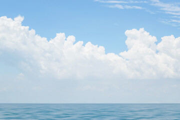 Obraz na płótnie Canvas Beautiful sky with clouds over blue sea water, big cloud above ocean