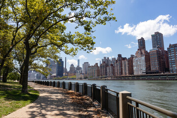 Empty Riverfront Path on Roosevelt Island in New York City during Summer with an Upper East Side Manhattan Skyline View