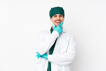 Surgeon in green uniform isolated on isolated white background smiling