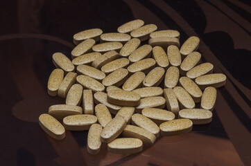 pills for infections on a glass table