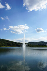 Fountain in the lake under the blue sky