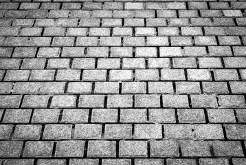 Dark brick wall texture background Masonry or stone flooring in the old style of stone. Black brick wall texture, brick texture for background, vintage dark gray bricks