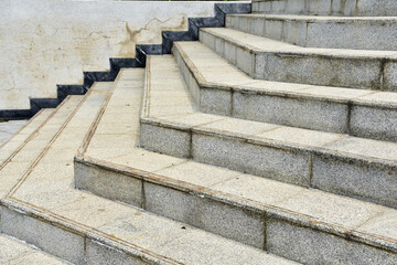 Modern architecture detail. Grunge texture of outdoor staircase. Step of rock stair with vintage style. 
