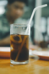 Soft drink in glass with ice on table at Thai local restaurants