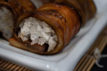 Vegan sushi rice rolled in teriyaki eggplant slices