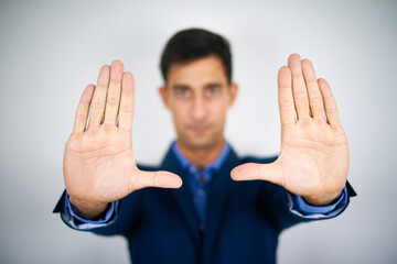 A businessman holding his palms in the air. Concept of framing, problem framing.