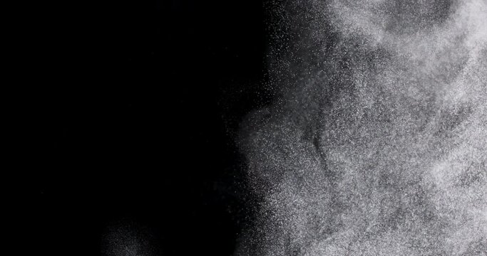White dust powder isolated on black background