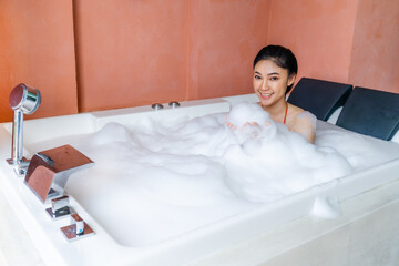 woman in bikini relaxing inside bathtub