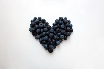 Blueberry heart shaped composition isolated on white background