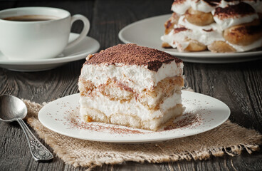 Delicious traditional tiramisu cake on a plate.
