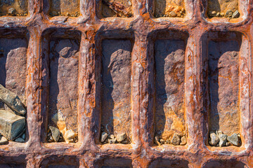 Rusty iron on pebble beach, Falkland Islands