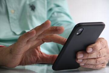 Man working in workplace on mobile in Digital world