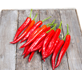 Fresh peppers on wooden floors isolated on white background