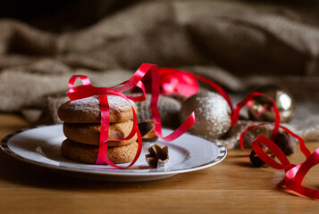Delicious homemade Christmas cookies on a light plate, close-up view. Beautiful composition with...