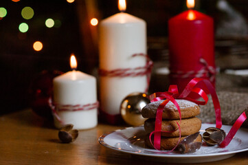 Delicious homemade Christmas cookies on a light plate, close-up view. Beautiful composition with Christmas cookies. New Year's atmosphere. Cookies for Santa.