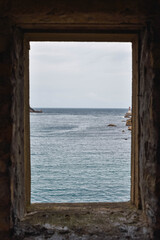 Window with sea view and blue sea