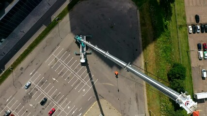 The tallest and largest mobile truck crane with extended boom, aerial top view.