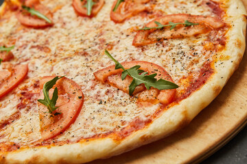 Delicious Italian Pizza Margarita on dark background