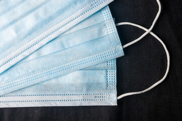 Background concept for news about the novel coronavirus COVID-19 pandemic, antiviral medical mask...