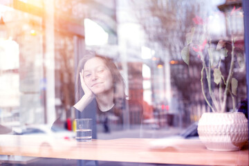 girl sitting with  cup of coffee