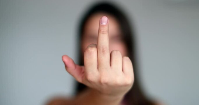 Woman giving the middle finger at camera